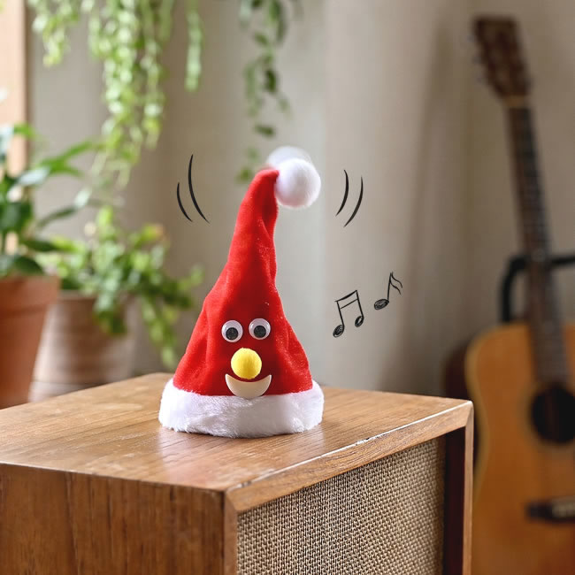 木製キャビネットに置いたサンタ帽と、揺れる動きや音楽を表すイラスト